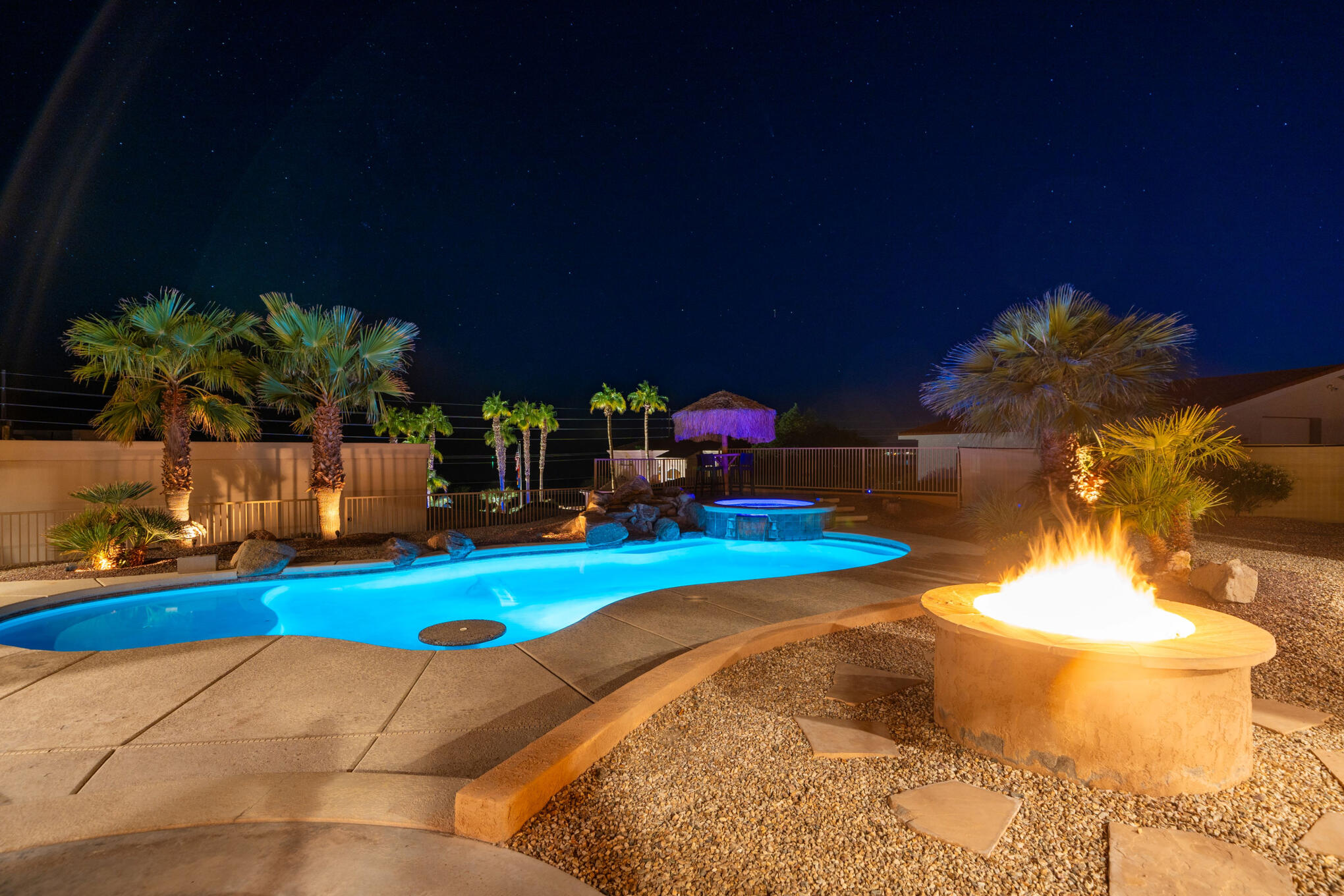 Night pool + fire pit photo Night view of pool and fire pit at Lakeview Lodge vacation rental in Lake Havasu City Arizona