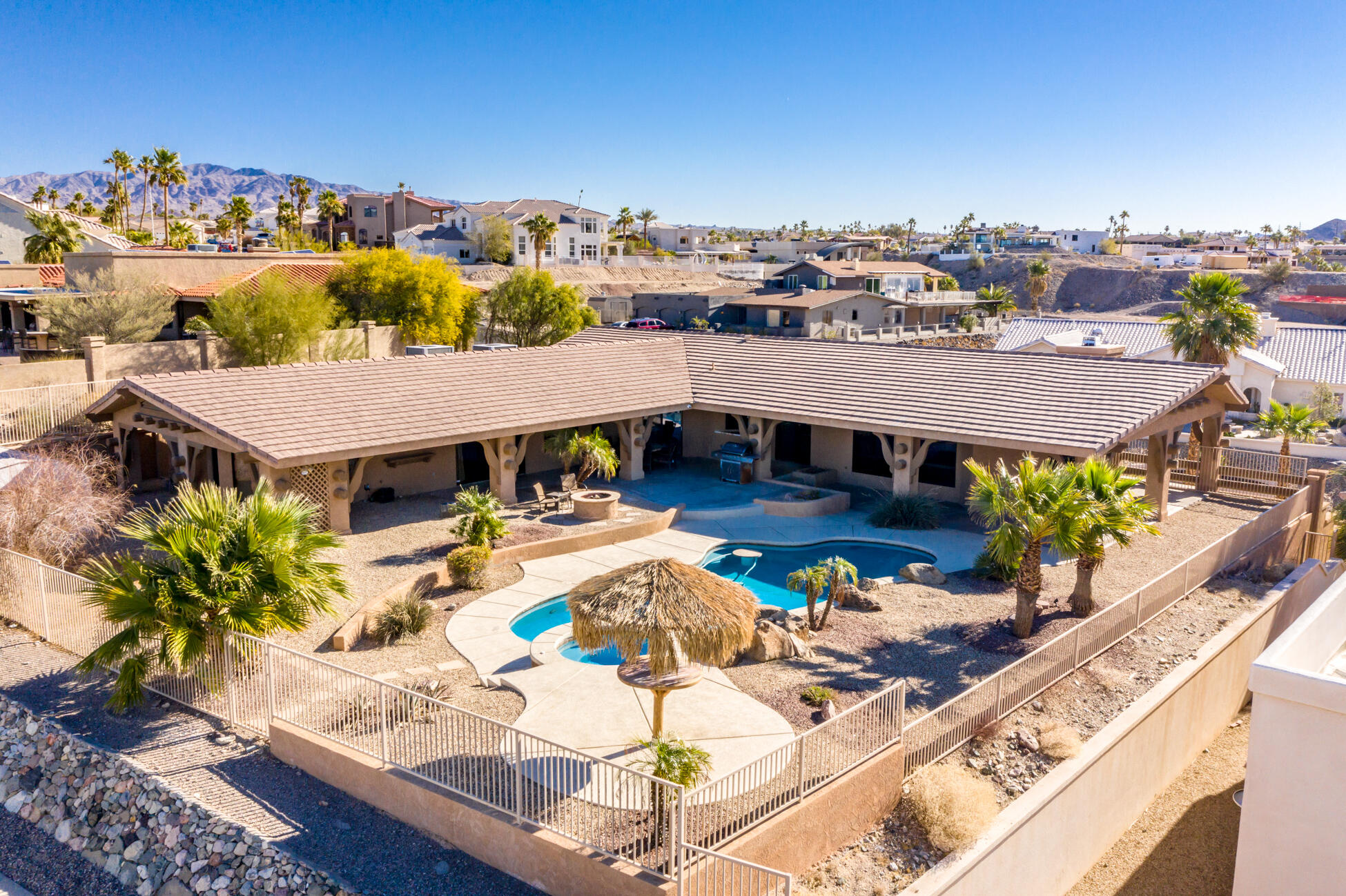 Aerial view of Lakeview Lodge vacation rental in Lake Havasu City Arizona showing private pool, spa, outdoor patio and surroundi Pool and lake views at Lakeview Lodge vacation rental in Lake Havasu City Arizona near the London Bridge